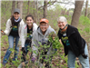 On the right, Merrily Borg Babcock posing with a few of her Cargill mustard seed removal team