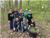 A team of Cargill employees pausing during a mustard seed plants removal in the Big Woods
