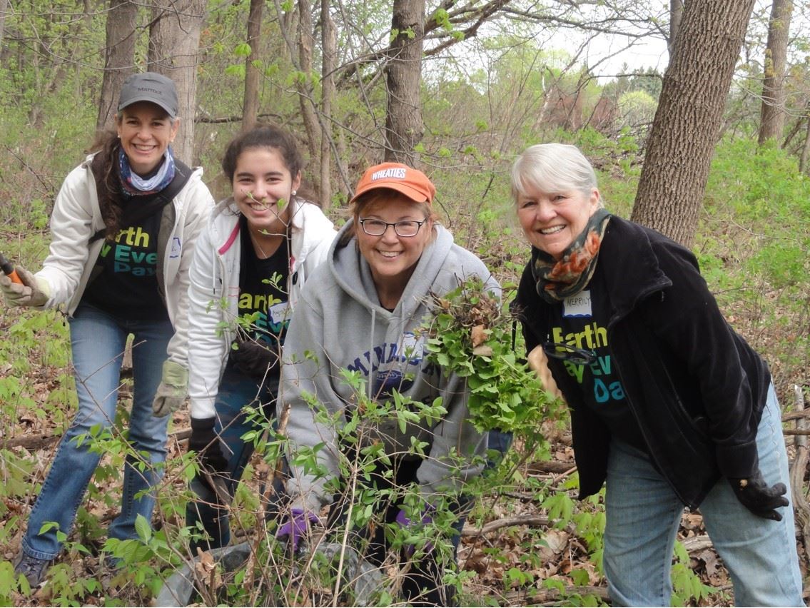 On the right, Merrily Borg Babcock posing with a few of her Cargill mustard seed removal team